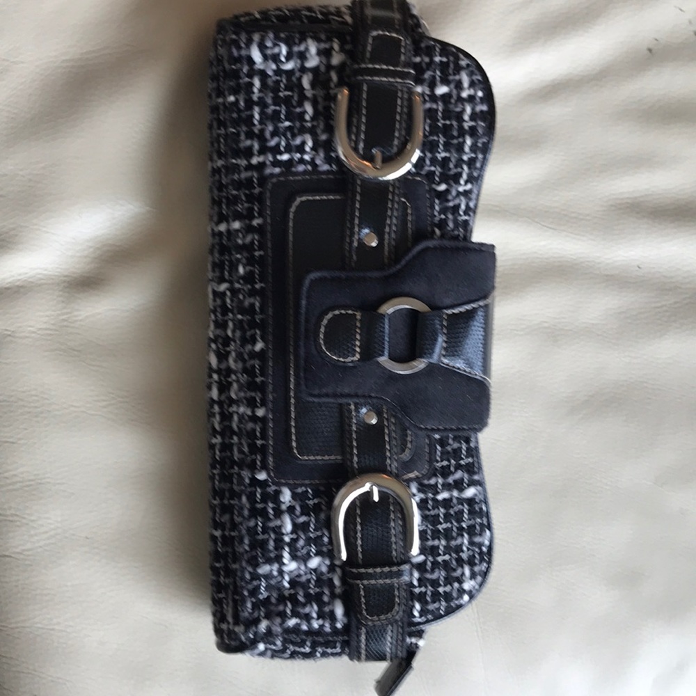 Worthington fabric clutch with leather detail.